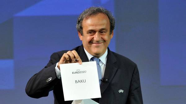 GENEVA, SWITZERLAND - SEPTEMBER 19:  UEFA President Michel Platini holds up the card for Baku who will host a quarter-final of the EURO 2020 during the UEFA EURO 2020 Host Cities & Final announcement ceremony held at Espace Hippomene on September 19, 2014 in Geneva, Switzerland.  (Photo by Harold Cunningham/Getty Images for UEFA)