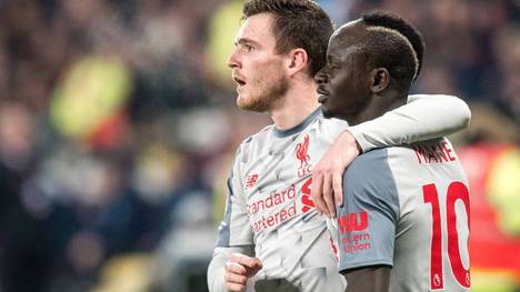 Sadio Mané (l.) und Andrew Robertson (r.) gewannen 2019 gemeinsam die Champions League