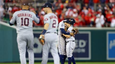 WASHINGTON, DC - OCTOBER 25:  Carlos Correa #1 and Jose Altuve #27 of the Houston Astros celebrate after the Astros defeated the Washington Nationals in Game 3 of the 2019 World Series at Nationals Park on Friday, October 25, 2019 in Washington, District of Columbia. (Photo by Alex Trautwig/MLB Photos via Getty Images)