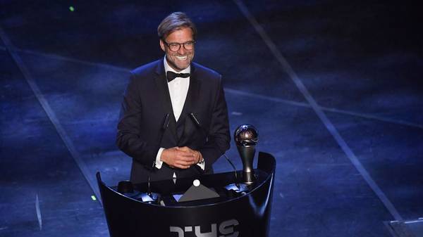 Liverpool coach, Germany's Juergen Klopp reacts after winning the trophy for the Best FIFA Men's Coach of 2019 Award during The Best FIFA Football Awards ceremony, on September 23, 2019 in Milan. (Photo by Marco Bertorello / AFP)        (Photo credit should read MARCO BERTORELLO/AFP/Getty Images)
