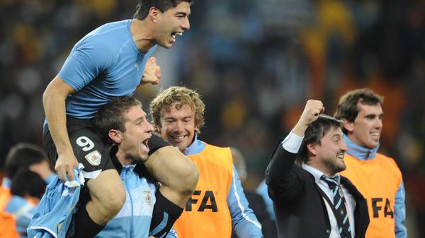 Uruguay's striker Luis Suarez (top) cele
