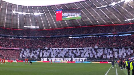 Die Fans des FC Bayern präsentieren vor dem Bundesliga-Spiel gegen Holstein Kiel eine besondere Choreo. Die Münchner erinnern an die verfolgten Bayern-Fans während der NS-Zeit.