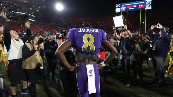 Lamar Jackson #8 of the Baltimore Ravens answers questions from the media after a game against the Los Angeles Rams 