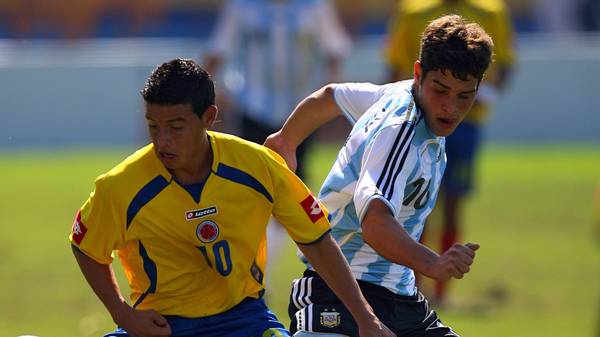 Argentine footballer Fabio Gimenez (R) v...