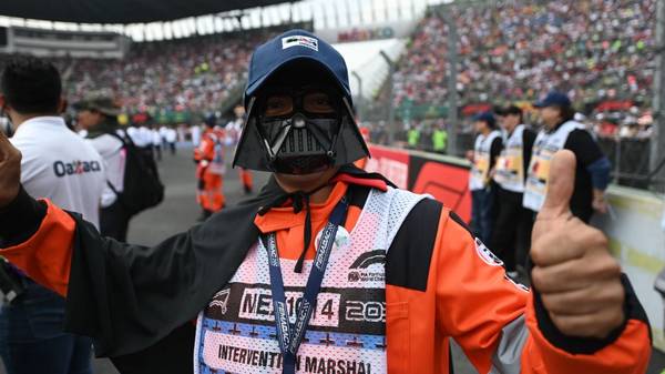 A track marshal wearing a costume is pictured prior to the start of the F1 Mexico Grand Prix at the Hermanos Rodriguez racetrack in Mexico City on October 27, 2019. (Photo by PEDRO PARDO / AFP) (Photo by PEDRO PARDO/AFP via Getty Images)