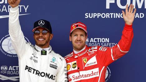 Sebastian Vettel (r.) und Lewis Hamilton machen den WM-Titel der Formel 1 unter sich aus