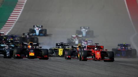 AUSTIN, TEXAS - NOVEMBER 03: Max Verstappen of the Netherlands driving the (33) Aston Martin Red Bull Racing RB15 and Sebastian Vettel of Germany driving the (5) Scuderia Ferrari SF90 battle for position into turn one at the start during the F1 Grand Prix of USA at Circuit of The Americas on November 03, 2019 in Austin, Texas. (Photo by Charles Coates/Getty Images)