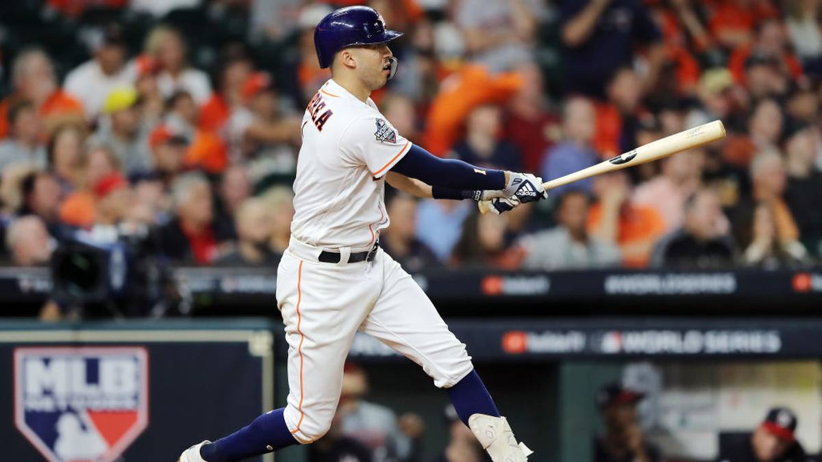 HOUSTON, TEXAS - OCTOBER 29:  Carlos Correa #1 of the Houston Astros hits a double against the Washington Nationals during the ninth inning in Game Six of the 2019 World Series at Minute Maid Park on October 29, 2019 in Houston, Texas. (Photo by Elsa/Getty Images)