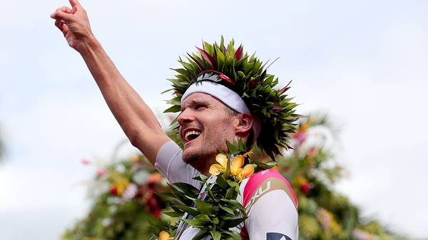 KAILUA KONA, HI - OCTOBER 08:  Jan Frodeno #1 of Germany celebrates after winning the 2016 IRONMAN World Championship triathlon on October 8, 2016 in Kailua Kona, Hawaii.  (Photo by Tom Pennington/Getty Images for Ironman)