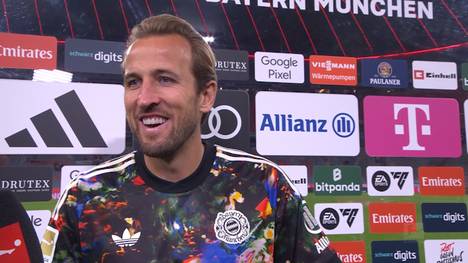 Harry Kane knackt beim 7:0-Sieg des FC Bayern gegen Union Berlin die 100-Tore-Marke in der Bundesliga. Nach dem Spiel legt der Stürmerstar den Fokus dennoch lieber auf seine Teamkollegen. Außerdem verrät er, wie seine Pläne für das Oktoberfest aussehen.