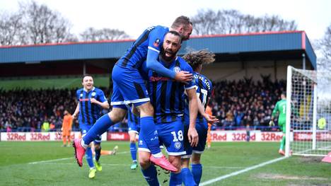 ROCHDALE, ENGLAND - JANUARY 04: Aaron Wilbraham of Rochdale celebrates with teammates after scoring his team's first goal during the FA Cup Third Round match between Rochdale AFC and Newcastle United at Spotland Stadium on January 04, 2020 in Rochdale, England. (Photo by Laurence Griffiths/Getty Images)