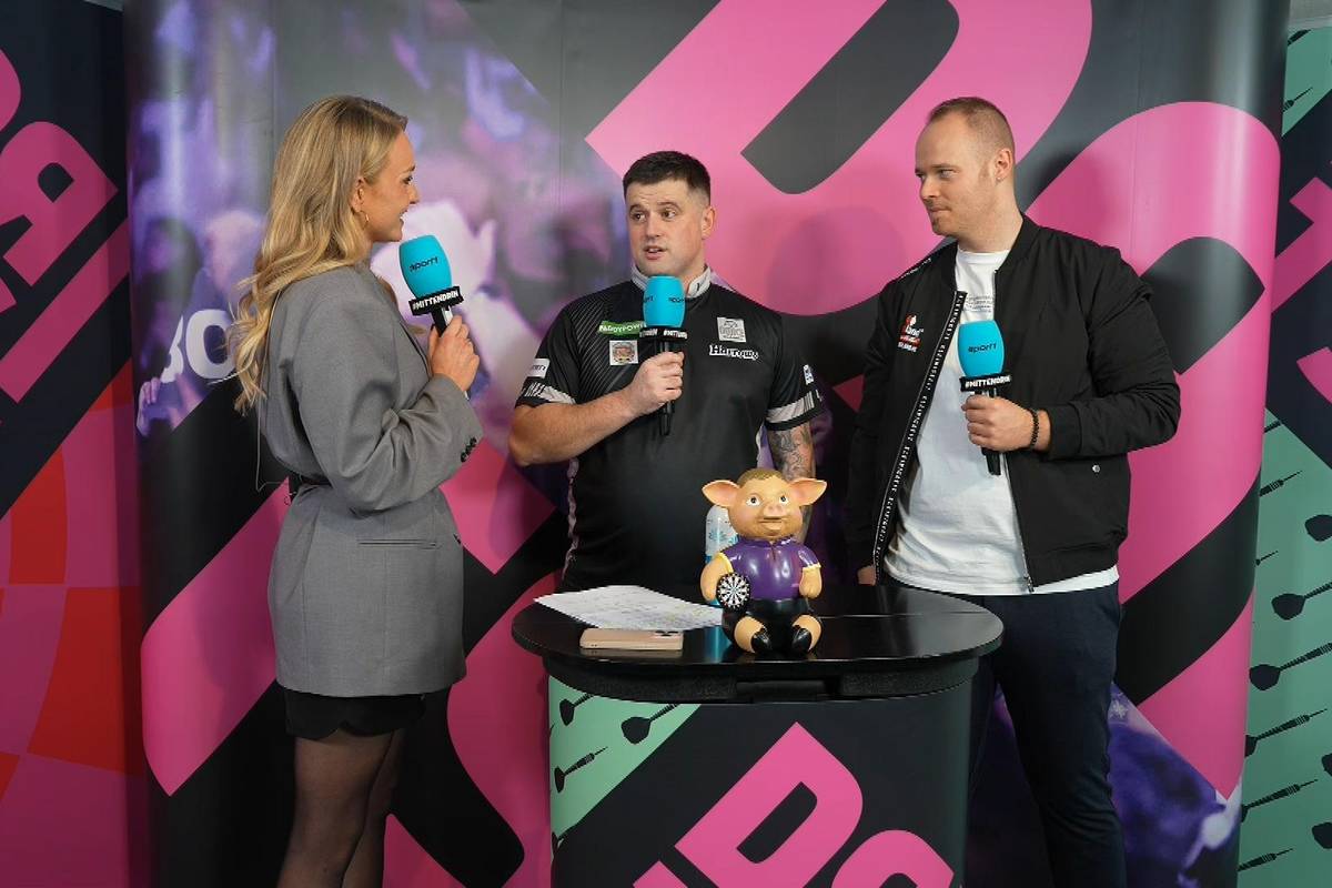 Luke Woodhouse steht nach seinem Sieg über Damon Heta im Achtelfinale der Darts-WM 2025. Im Interview erklärt er, warum er trotz Rückstand den Neun-Darter seines Gegners bejubelte.