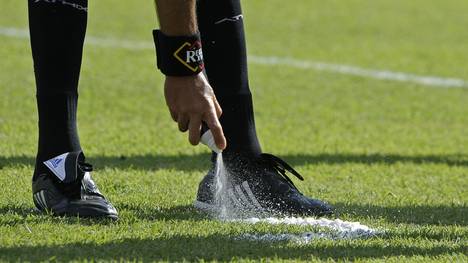 Argentine referee Alejandro Sabino marks