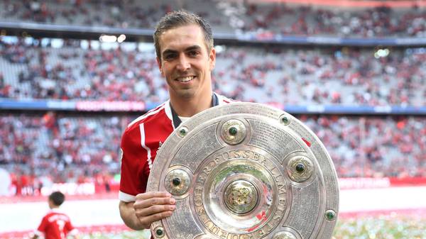 MUNICH, GERMANY - MAY 20:  Philipp Lahm of Bayern Muenchen poses with the Championship trophy in celebration of the 67th German Championship title following the Bundesliga match between Bayern Muenchen and SC Freiburg at Allianz Arena on May 20, 2017 in Munich, Germany.  (Photo by Alexander Hassenstein/Bongarts/Getty Images)