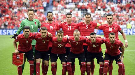 Albania's national football team, (front row, LtoR) Albania's defender Elseid Hysaj, Albania's midfielder Burim Kukeli, Albania's midfielder Amir Abrashi, Albania's defender Ansi Agolli, Albania's midfielder Taulant Xhaka and Albania's midfielder Ermir Lenjani, and (back row, LtoR) Albania's goalkeeper Etrit Berisha, Albania's defender Mergim Mavraj, Albania's midfielder Odise Roshi, Albania's defender Lorik Cana and Albania's forward Armando Sadiku pose for a team photo ahead of the Euro 2016 group A football match between Albania and Switzerland at the Bollaert-Delelis Stadium in Lens on June 11, 2016. / AFP / MARTIN BUREAU        (Photo credit should read MARTIN BUREAU/AFP/Getty Images)