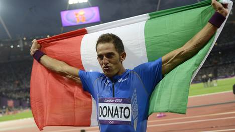 Italy's Fabrizio Donato celebrates after