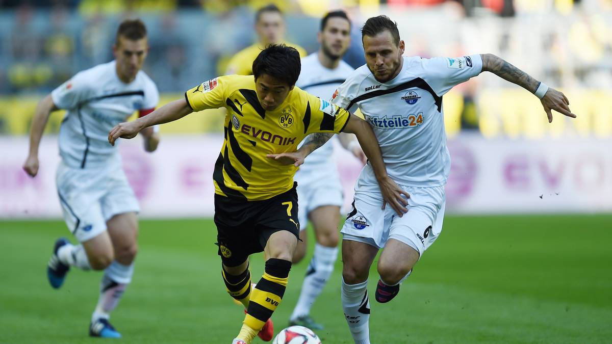 Die Dortmunder tun sich schwer. Hier wird Shinji Kagawa  von Marvin Bakalorz gestört. Ohne Tore geht es in die Pause

