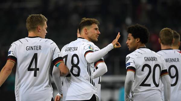 Germany's Matthias Ginter, Germany's Leon Goretzka and Germany's Serge Gnabry (L-R) celebrate a goal during the UEFA Euro 2020 Group C qualification football match between Germany and Belarus, on November 16, 2019 in Moenchengladbach. (Photo by INA FASSBENDER / AFP) (Photo by INA FASSBENDER/AFP via Getty Images)