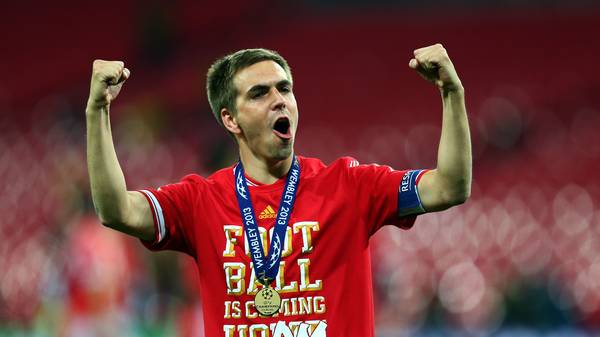 LONDON, ENGLAND - MAY 25:  Philipp Lahm of Bayern Muenchen celebrates after winning the UEFA Champions League final match against Borussia Dortmund at Wembley Stadium on May 25, 2013 in London, United Kingdom.  (Photo by Alex Grimm/Getty Images)