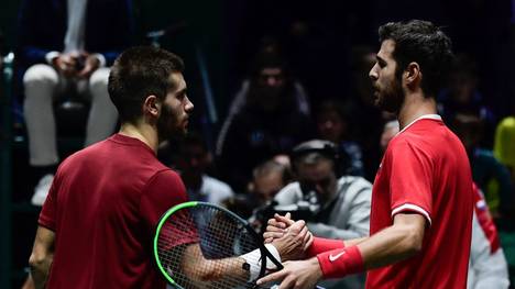 Russia's Karen Khachanov (R) and Croatia's Borna Coric shake hands after their singles tennis match between Croatia and Russia at the Davis Cup Madrid Finals 2019 in Madrid on November 18, 2019. (Photo by JAVIER SORIANO / AFP) (Photo by JAVIER SORIANO/AFP via Getty Images)