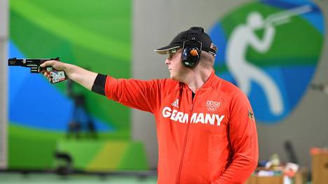 Gold medal winner Germany's Christian Reitz competes during the 25m Rapid Fire Pistol men's final at the Olympic Shooting Centre in Rio de Janeiro on August 13, 2016, during the Rio 2016 Olympic Games. / AFP / PASCAL GUYOT        (Photo credit should read PASCAL GUYOT/AFP/Getty Images)