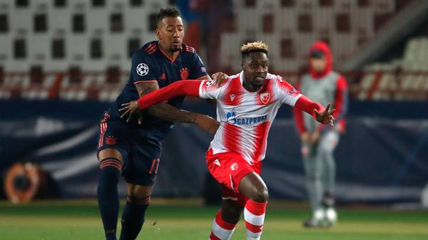 Bayern Munich's German defender Jerome Boateng (L) fights for the ball with Red Star Belgrade's Ghanaian forward Richmond Boakye during the UEFA Champions League group B football match between Red Star Belgrade (Crvena Zvezda Belgrade) and Bayern Munich at the "Rajko Mitic" stadium in Belgrade, on November 26, 2019. (Photo by Pedja Milosavljevic / AFP) (Photo by PEDJA MILOSAVLJEVIC/AFP via Getty Images)