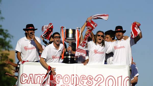 Sevilla's players celebrate with their t