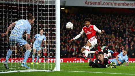 LONDON, ENGLAND - JANUARY 06:  Reiss Nelson of Arsenal scores his side's first goal during the FA Cup Third Round match between Arsenal FC and Leeds United at the Emirates Stadium on January 06, 2020 in London, England. (Photo by Julian Finney/Getty Images)