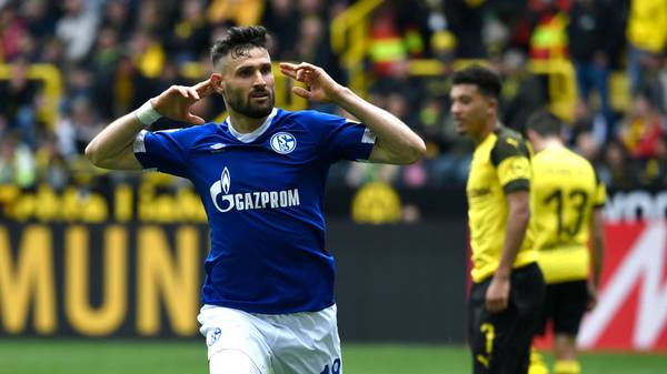 Schalke's German midfielder Daniel Caligiuri celebrates scoring during the German First division Bundesliga football match BVB Borussia Dortmund v Schalke 04 in Dortmund, western Germany on April 27, 2019. (Photo by INA FASSBENDER / AFP) / DFL REGULATIONS PROHIBIT ANY USE OF PHOTOGRAPHS AS IMAGE SEQUENCES AND/OR QUASI-VIDEO        (Photo credit should read INA FASSBENDER/AFP/Getty Images)