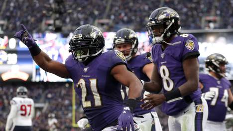 BALTIMORE, MARYLAND - NOVEMBER 17: Mark Ingram #21 of the Baltimore Ravens celebrates with Lamar Jackson #8 after scoring a fourth quarter touchdown against the Houston Texans at M&T Bank Stadium on November 17, 2019 in Baltimore, Maryland. (Photo by Rob Carr/Getty Images)