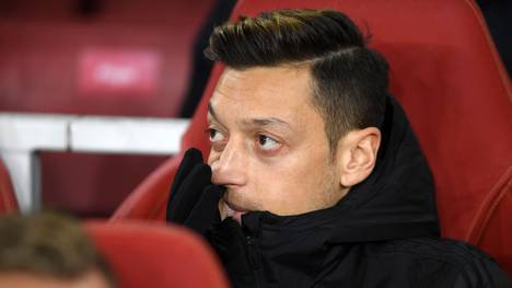 LONDON, ENGLAND - NOVEMBER 28: Mesut Ozil of Arsenal looks on from the substitute bench ahead of the UEFA Europa League group F match between Arsenal FC and Eintracht Frankfurt at Emirates Stadium on November 28, 2019 in London, United Kingdom. (Photo by Mike Hewitt/Getty Images)