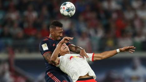 LEIPZIG, GERMANY - SEPTEMBER 14: Jerome Boateng of Bayern Munich and Yussuf Poulsen of RB Leipzig battle for the ball during the Bundesliga match between RB Leipzig and FC Bayern Muenchen at Red Bull Arena on September 14, 2019 in Leipzig, Germany. (Photo by Maja Hitij/Bongarts/Getty Images)