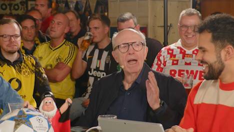 Reiner Calmund wendet sich live im TV an seine Frau. Sie findet, er schreie zu laut ins Mikro im SPORT1-Fantalk - die Antwort ist jetzt schon legendär. 