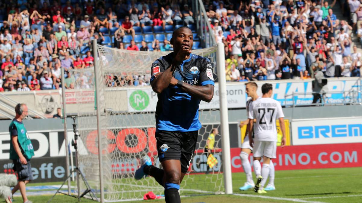 PADERBORN, GERMANY - AUGUST 24: Streli Mamba of SC Paderborn celebrates after scoring his sides first goal during the Bundesliga match between SC Paderborn 07 and Sport-Club Freiburg at Benteler Arena on August 24, 2019 in Paderborn, Germany. (Photo by Christof Koepsel/Bongarts/Getty Images)