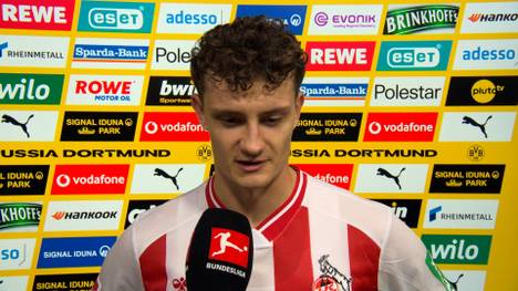 Nach der knappen Niederlage gegen den BVB ringt Eric Martel vom 1. FC Köln um Worte und zeigt sich sichtlich angefasst aufgrund der Horror-Verletzung von Timo Hübers.