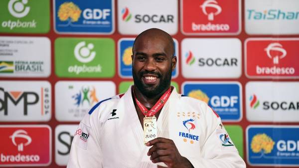 France's Teddy Riner poses on the podium with his medal after defeating Brazil's David Moura in the men's over 100 kg category final combat of the Judo Grand Slam Brasilia 2019, in Brasilia, on October 8, 2019. (Photo by EVARISTO SA / AFP) (Photo by EVARISTO SA/AFP via Getty Images)