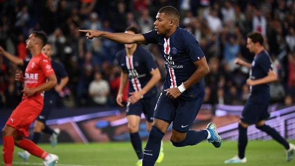 TOPSHOT - Paris Saint-Germain's French forward Kylian Mbappe celebrates after scoring the 2-0 goal during the French L1 football match between Paris Saint-Germain (PSG) and Nimes Olympique on August 11, 2019 at the Parc des Princes stadium in Paris. (Photo by FRANCK FIFE / AFP)        (Photo credit should read FRANCK FIFE/AFP/Getty Images)