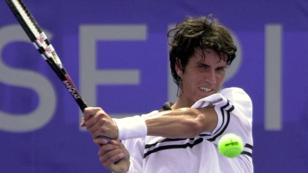 Juan Ignacio Chela of Argentina returns a volley a