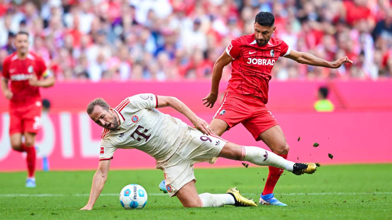 Harry Kane (l.) im Zweikampf mit Vincenzo Grifo (r.)