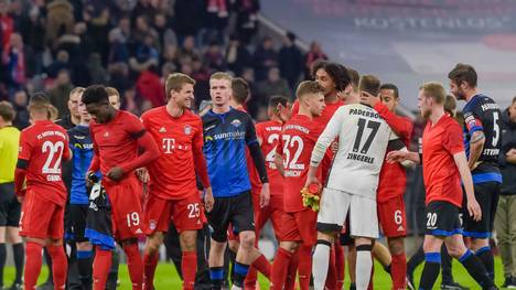Players react after the German first division Bundesliga football match FC Bayern Munich v SC Paderborn in Munich, southern Germany, on February 21, 2020. (Photo by Guenter SCHIFFMANN / AFP) / RESTRICTIONS: DFL REGULATIONS PROHIBIT ANY USE OF PHOTOGRAPHS AS IMAGE SEQUENCES AND/OR QUASI-VIDEO (Photo by GUENTER SCHIFFMANN/AFP via Getty Images)