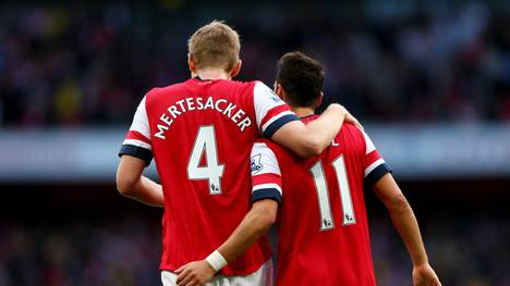 Per Mertesacker und Mesut Özil spielen beim FC Arsenal
