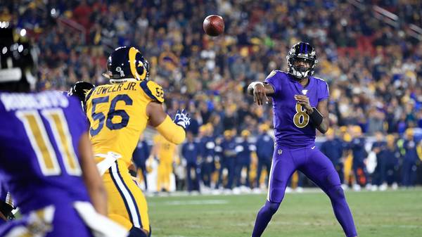 Quarterback Lamar Jackson #8 of the Baltimore Ravens delivers a pass against the Los Angeles Rams
