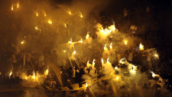 Supporters of Boca Juniors light flares