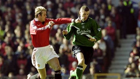 4 Mar 2000:  Dominic Matteo of Liverpool takes on David Beckham of Manchester United during the FA Carling Premiership match at Old Trafford in Manchester, England. The game ended 1-1. \ Mandatory Credit: Clive Brunskill /Allsport