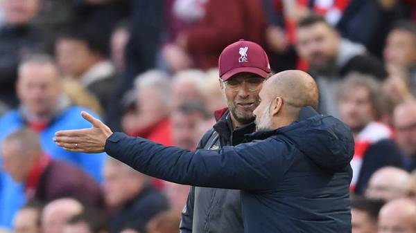 LIVERPOOL, ENGLAND - OCTOBER 07:  Jurgen Klopp, Manager of Liverpool talks with Josep Guardiola, Manager of Manchester City during the Premier League match between Liverpool FC and Manchester City at Anfield on October 7, 2018 in Liverpool, United Kingdom.  (Photo by Laurence Griffiths/Getty Images)
