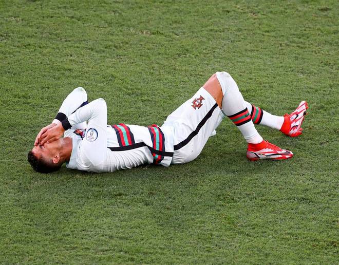 Cristiano Ronaldo holds his face