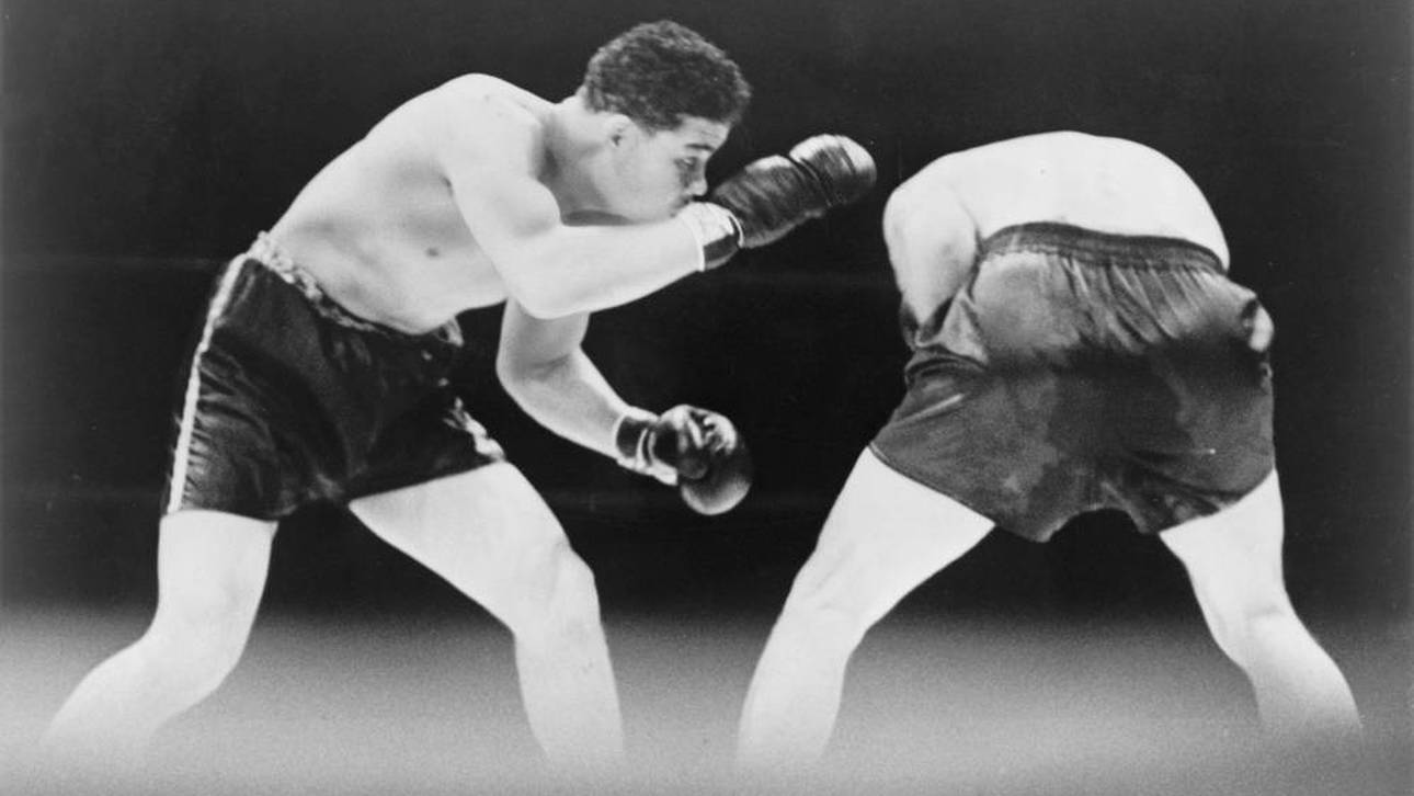 Max Schmeling (l.) fügte Joe Louis 1936 eine überraschende Niederlage zu