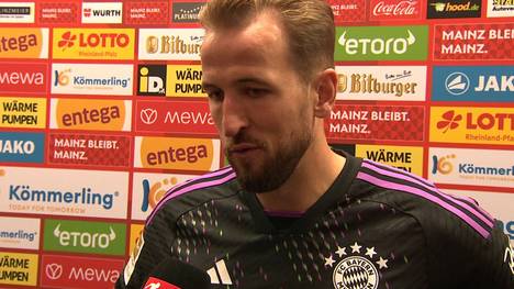 Harry Kane zeigt sich nach dem Sieg des FC Bayern bei Mainz 05 zufrieden - sieht aber auch noch Luft nach oben. Seinem israelischen Teamkollegen Daniel Peretz sichert er die Unterstützung der Mannschaft zu.