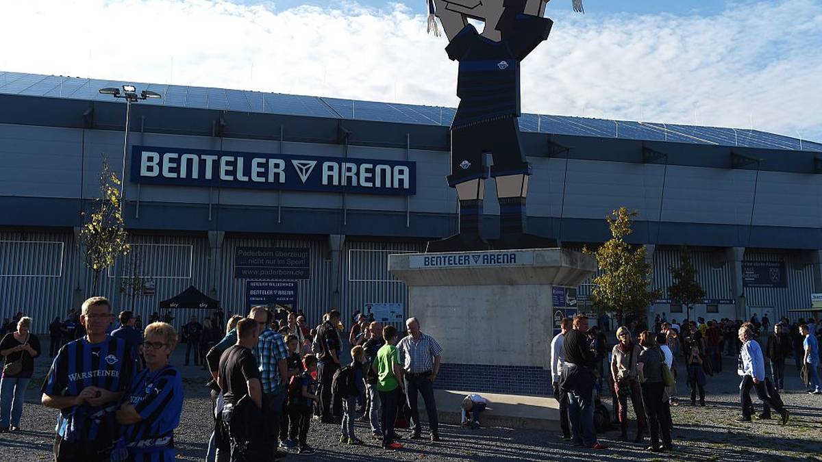 People wait in front of the Paderborn Benteler Arena prior to the German first division Bundesliga football match SC Paderborn vs Eintracht Frankfurt in Paderborn, western Germany on October 19, 2014. AFP PHOTO / PATRIK STOLLARZDFL RULES TO LIMIT THE ONLINE USAGE DURING MATCH TIME TO 15 PICTURES PER MATCH. FOR FURTHER QUERIES PLEASE CONTACT DFL DIRECTLY AT + 49 69 650050.        (Photo credit should read PATRIK STOLLARZ/AFP via Getty Images)