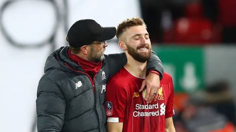 LIVERPOOL, ENGLAND - JANUARY 05: Jurgen Klopp, Manager of Liverpool speaks to Nathaniel Phillips of Liverpool after the FA Cup Third Round match between Liverpool and Everton at Anfield on January 05, 2020 in Liverpool, England. (Photo by Clive Brunskill/Getty Images)